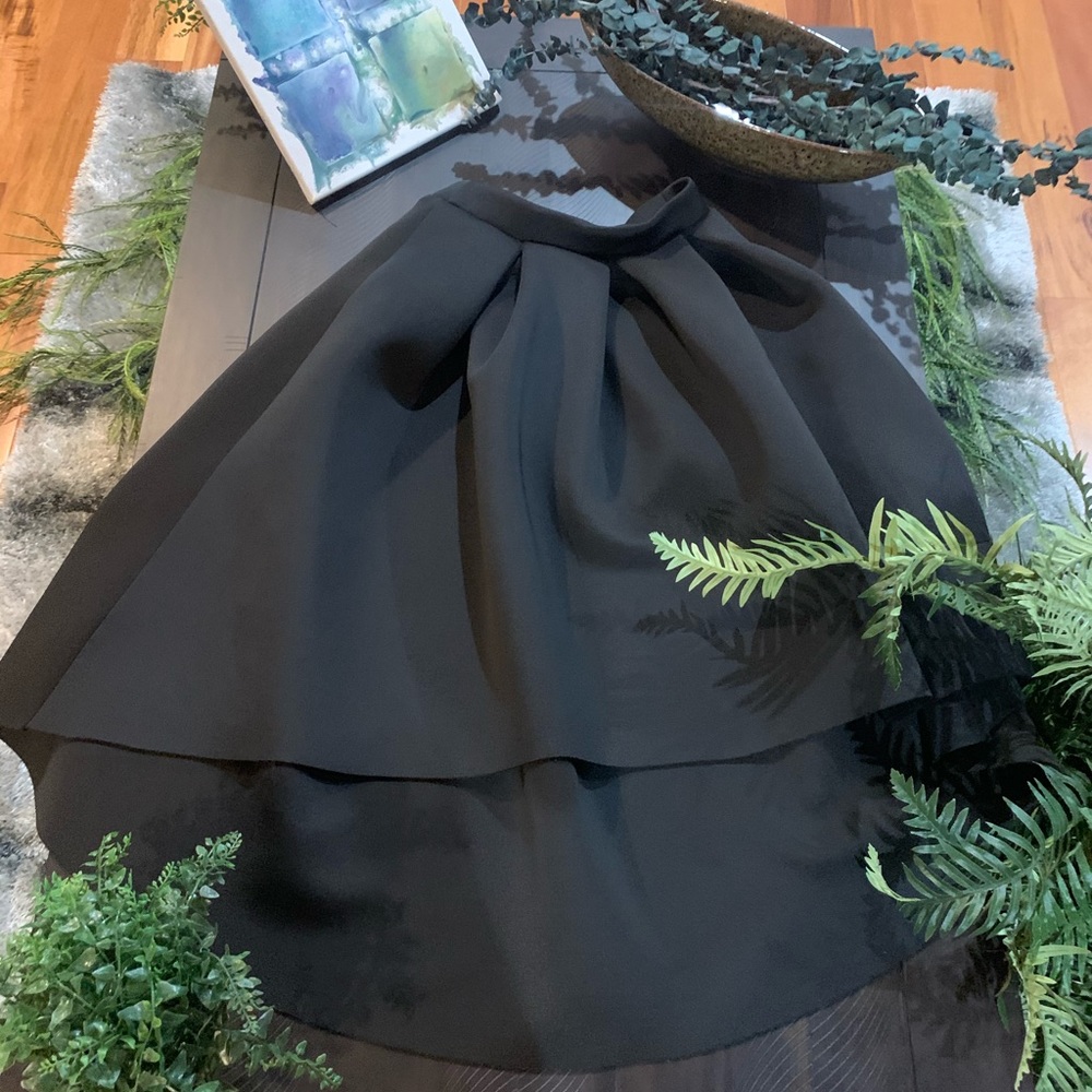Structured asymmetrical black skirt.